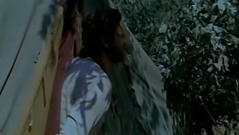 A Married Woman Engages In Passionate Encounter With A Black Man, While Her Unsuspecting Husband Watches From Nearby Bushes